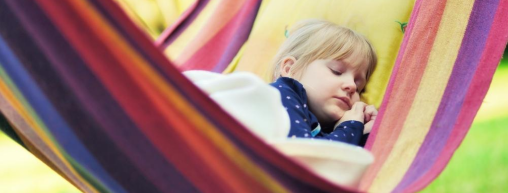 Child asleep in a hammock staycation