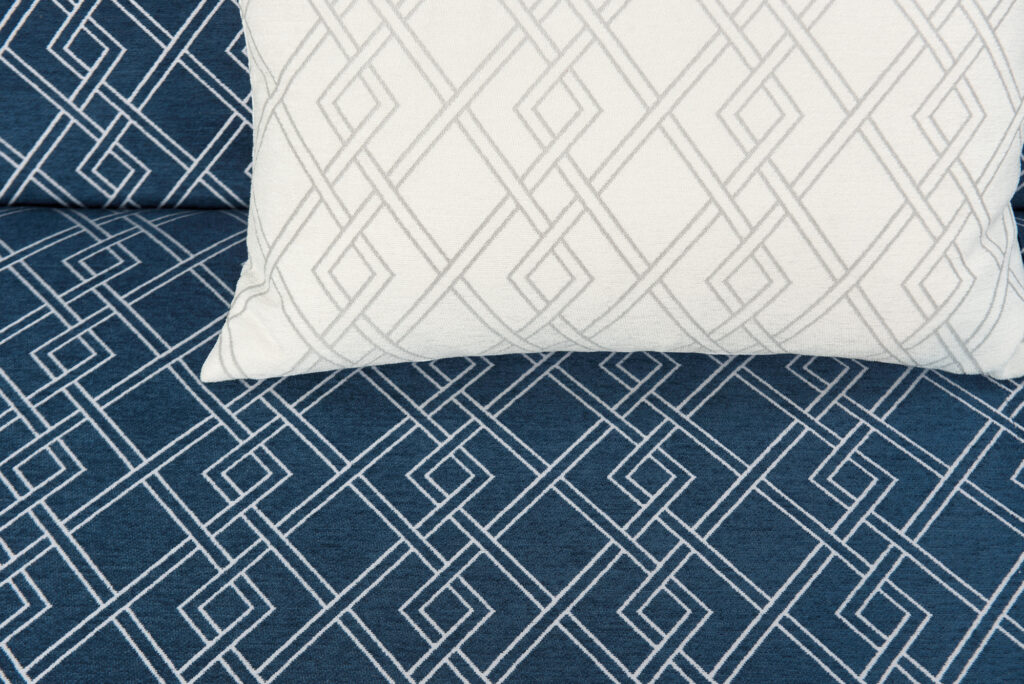 closeup blue and white patterened pillows in easy clean fibreguard fabrics